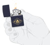 Zippo Campfire Design Navy Matte Windproof Lighter lit in hand.