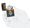 Zippo Tiger Stripes Design Black Matte Windproof Lighter lit in hand.
