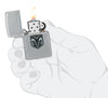 Zippo Dodge RAM Design Street Chrome Windproof Lighter lit in hand.