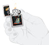 Zippo Cool Chick Design Satin Chrome Windproof Lighter lit in hand.