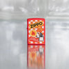 Lifestyle image of Zippo Retro Design Red Matte Windproof Lighter on a reflective glass block background.