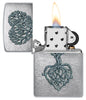 Zippo Rooted in Love Design Brushed Chrome Windproof Lighter with its lid open and lit.