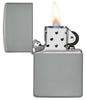 Flat Grey Windproof Lighter with its lid open and lit