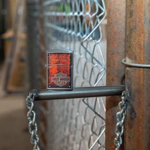 Lifestyle image of Harley-Davidson® Chromed Out Logo Street Chrome™ Windproof Lighter standing in a garage scene.